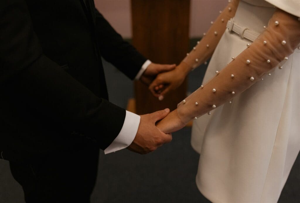 bride and groom holding hands at their elopement