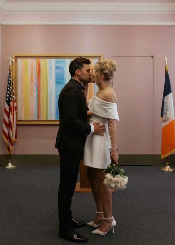 bride and groom kissing after their ceremony