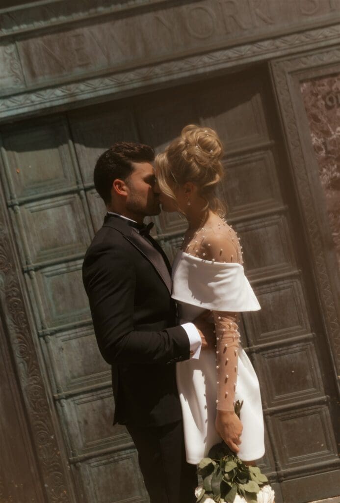 portrait of the newlyweds kissing during their bridal portraits in new york