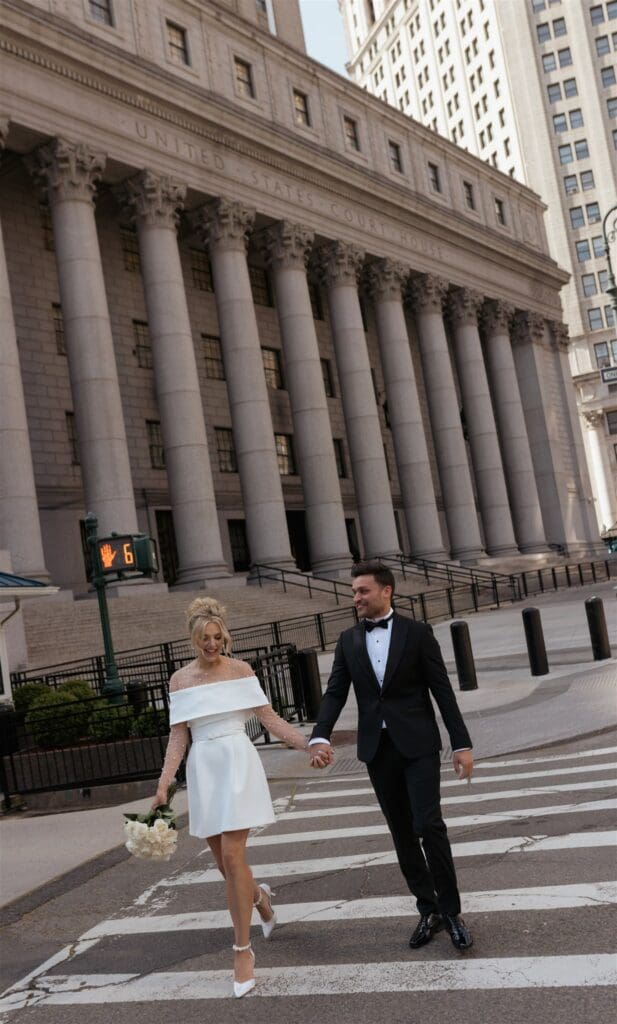 cute picture of the newlyweds walking around NYC during their bridal session