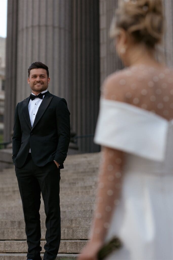cute picture of the groom looking at the bride
