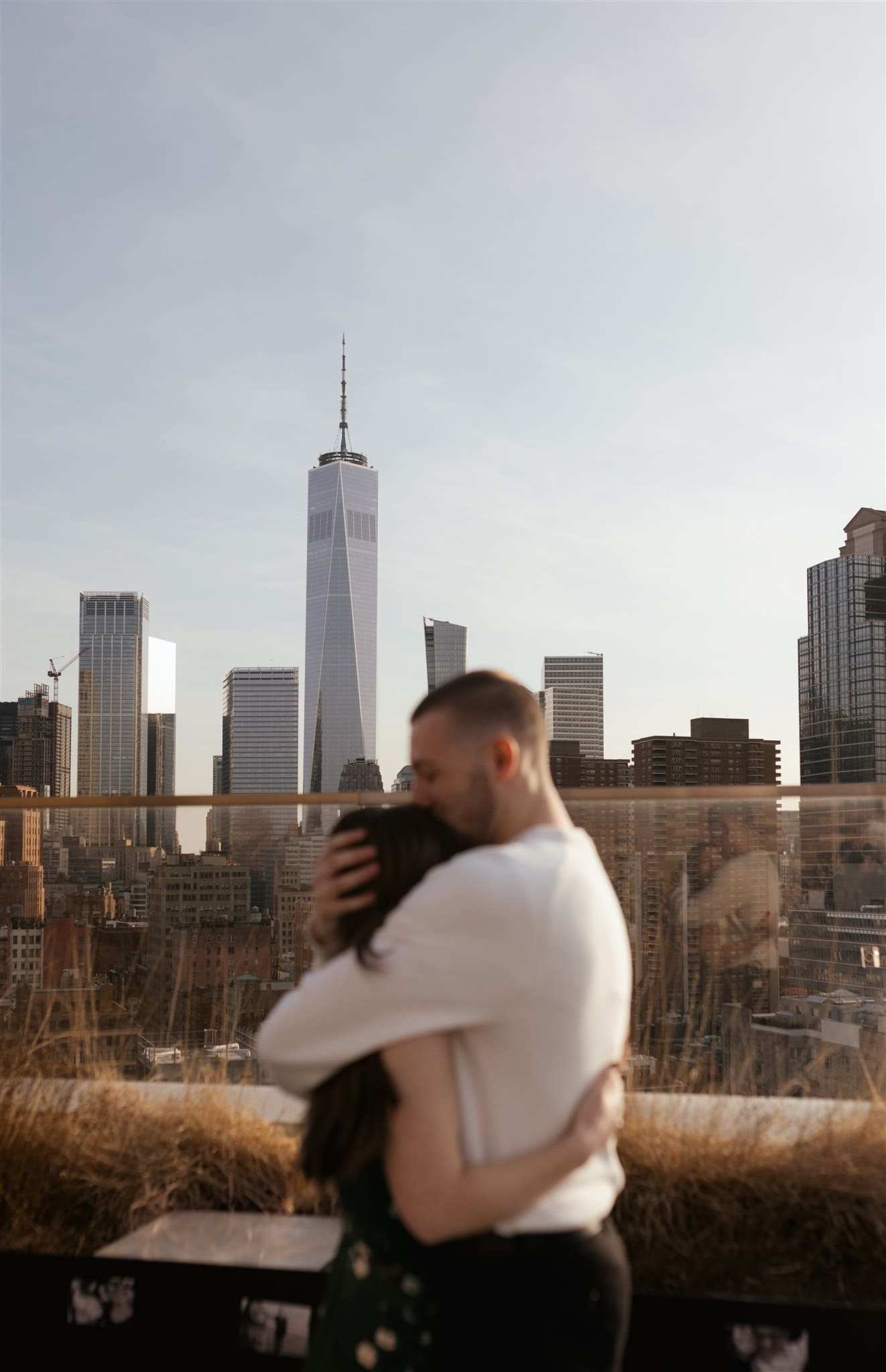newly engaged couple hugging