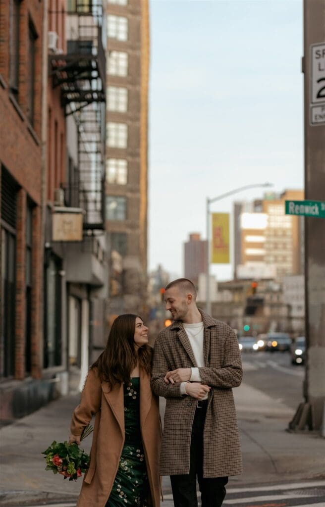 cute couple walking around manhattan laughing with each other