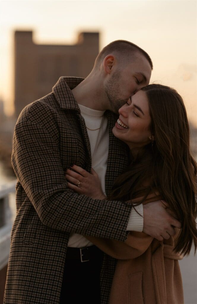 fiance kissing his fiance on the cheek