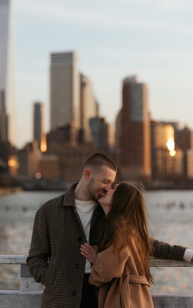 cute picture of the newly engaged couple kissing