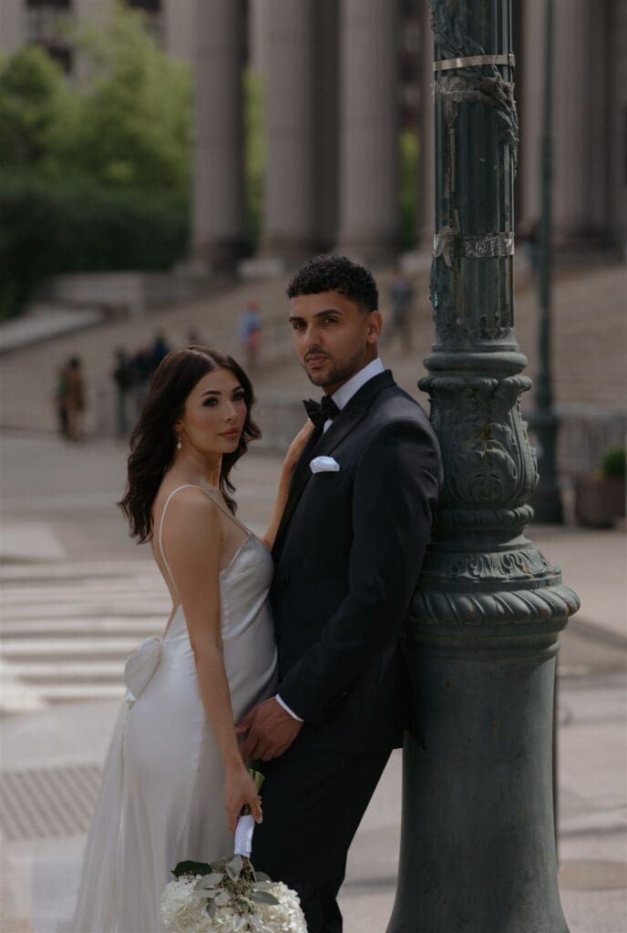 cute couple smiling at the camera during their bridal portraits