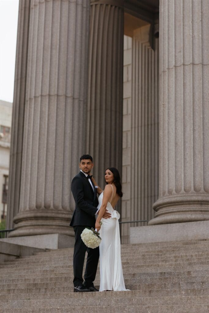 cute couple posing for the camera during their bridal portraits