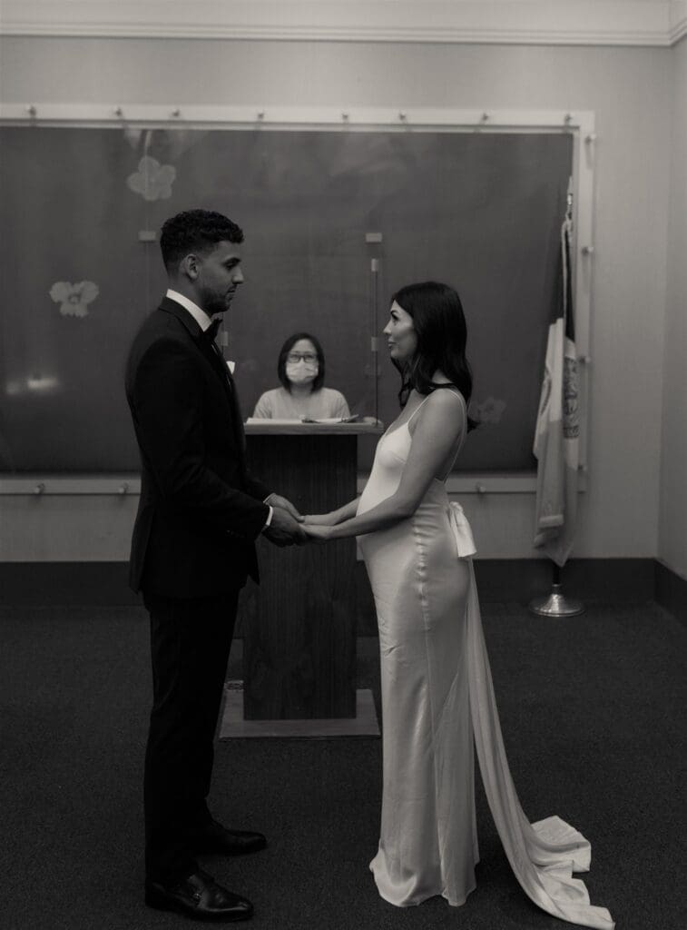 cute couple holding hands at their ceremony