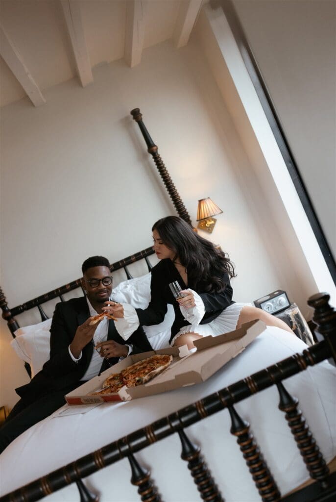 happy couple having pizza after their engagement session