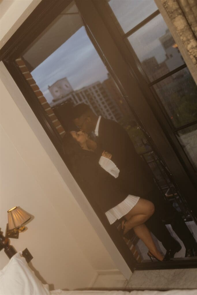 picture of the newly engaged couple kissing during their photoshoot