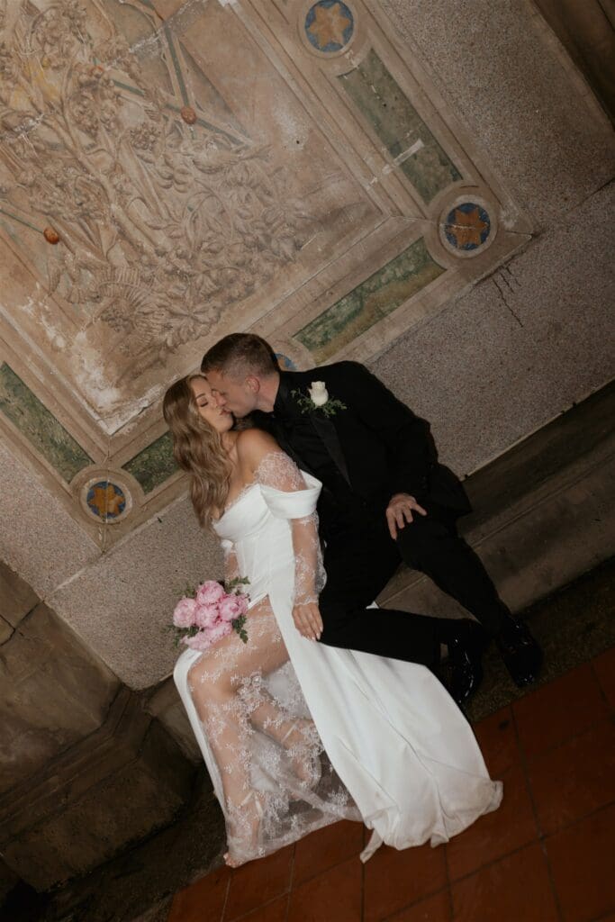 portrait of the newlyweds kissing during their bridal session