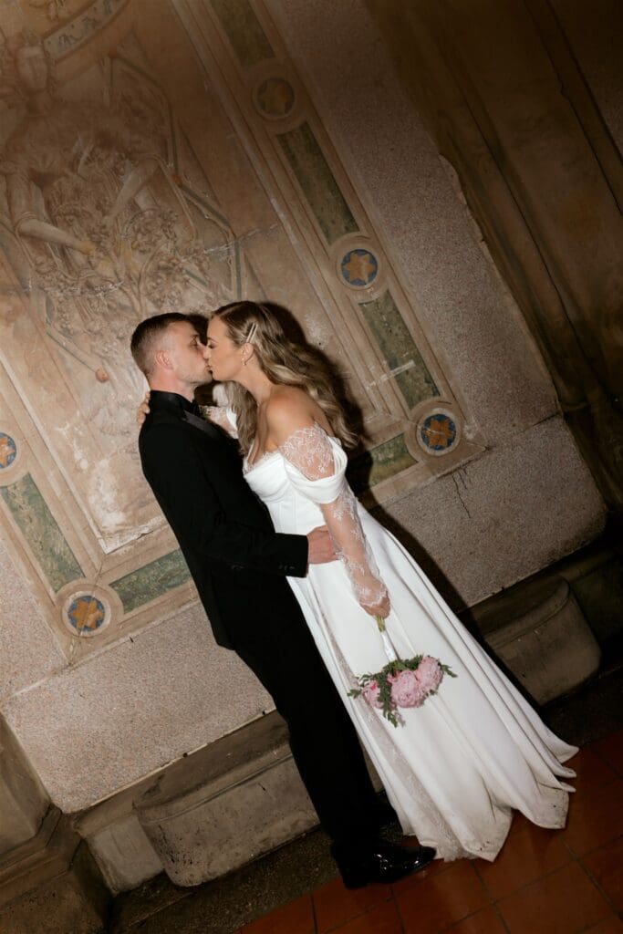 cute couple kissing during their bridal portraits