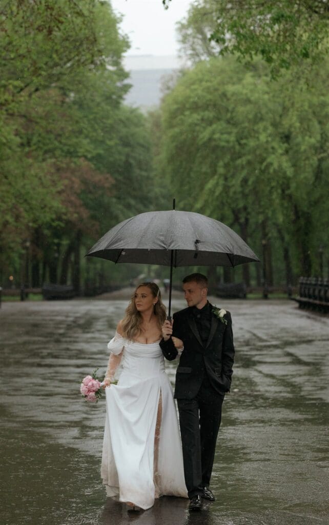 bride and groom walking around central park during their bridal portraits
