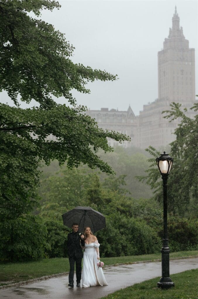 cute couple walking around central park after their elopement