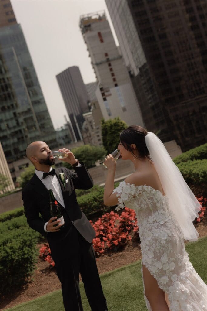 couple having champagne after their elopement