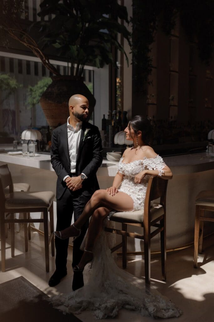 couple celebrating their elopement with some drinks