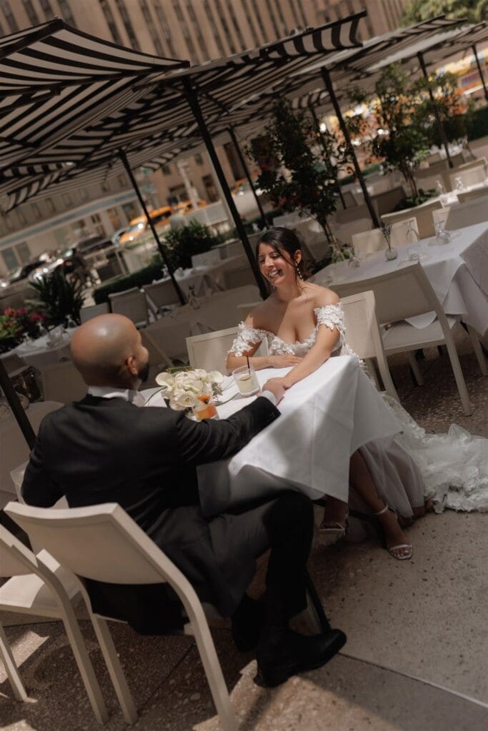 bride and groom laughing with each other during their bridal session around NYC