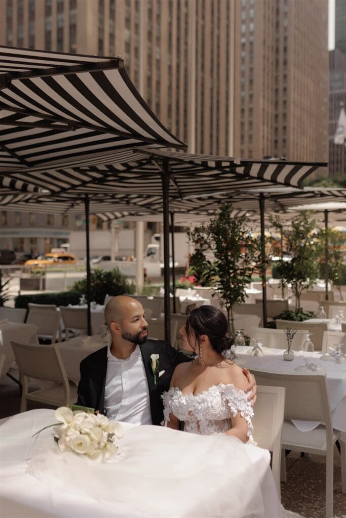 couple smiling at each other during their session