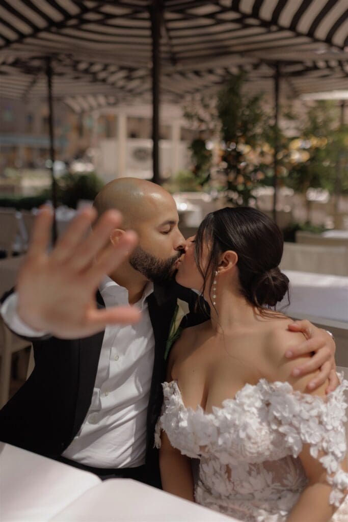 cute portrait of the newlyweds kissing