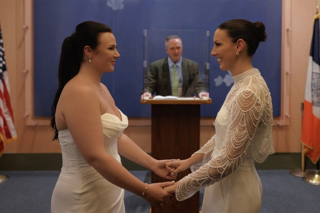 Couple holding hands during their elopement ceremony