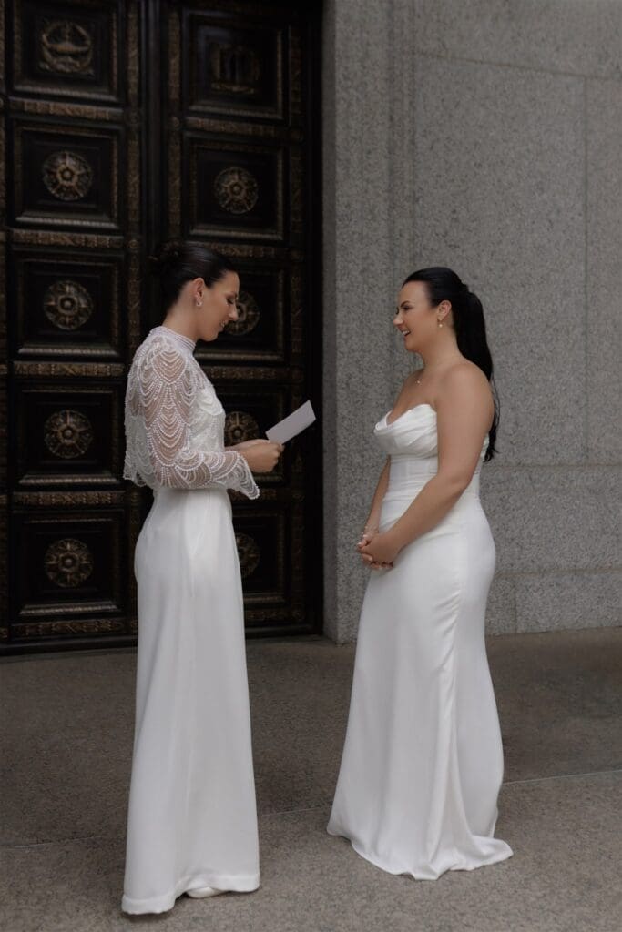 Happy couple reading their vows after their ceremony