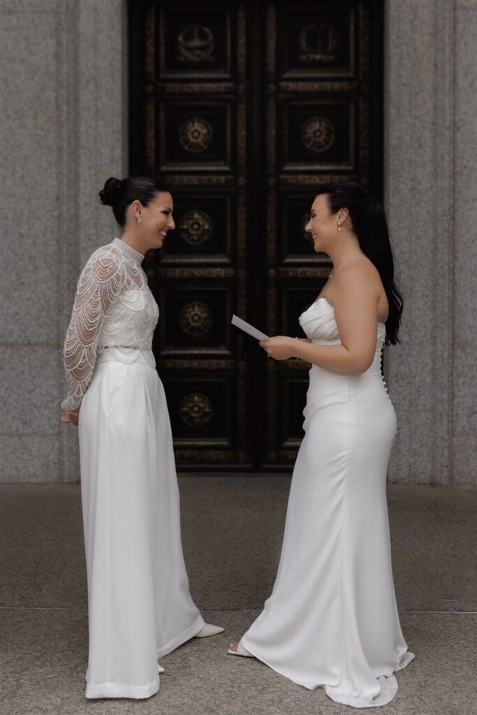 Cute picture of the newlyweds reading their vows