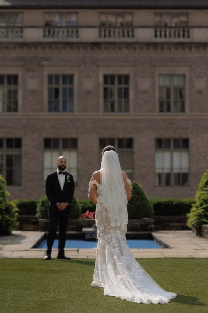 groom emotional seeing the bride in her wedding dress