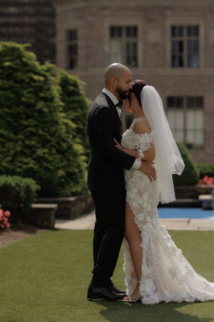 groom kissing the bride on the forehead