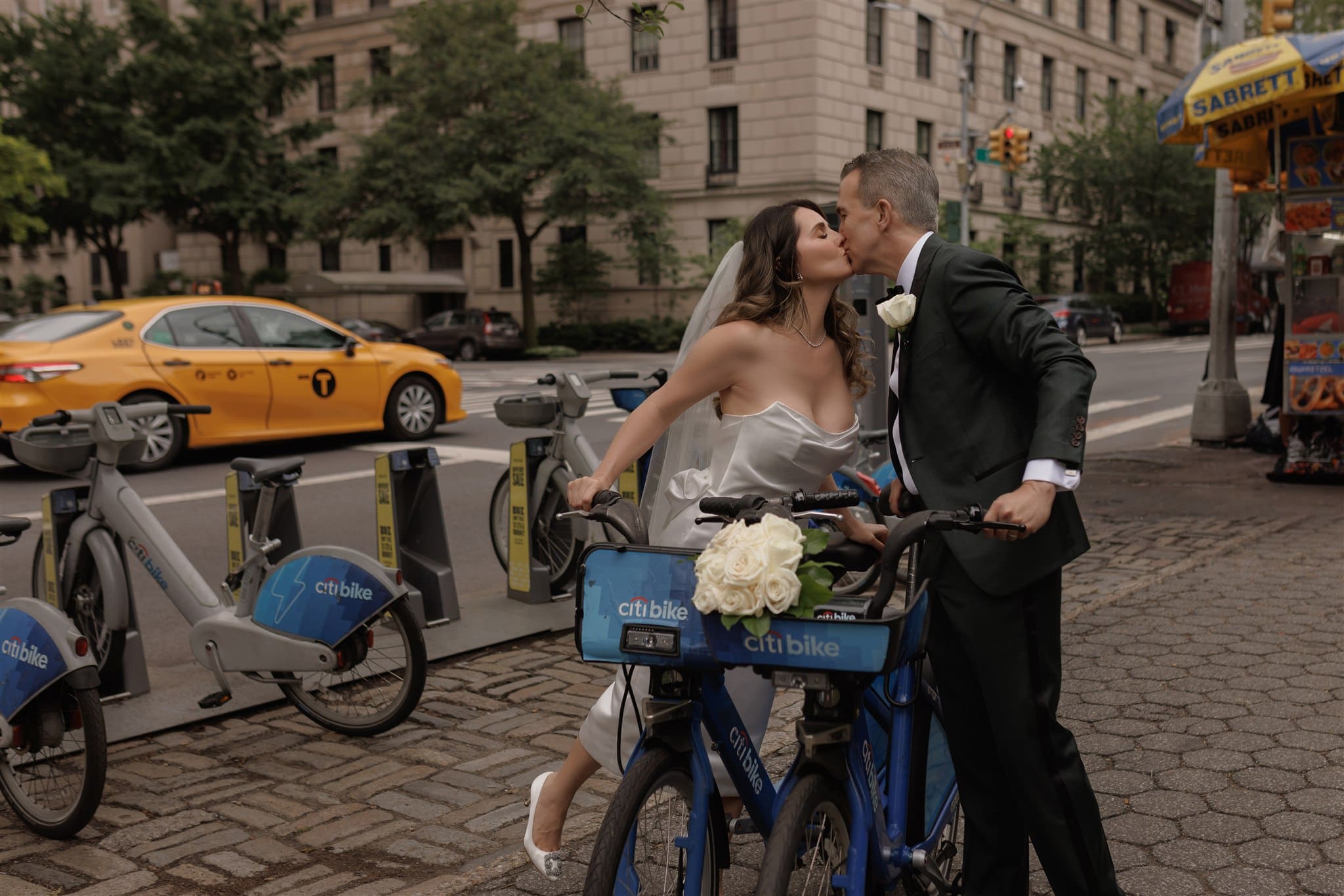 cute couple riding bikes after their ceremony