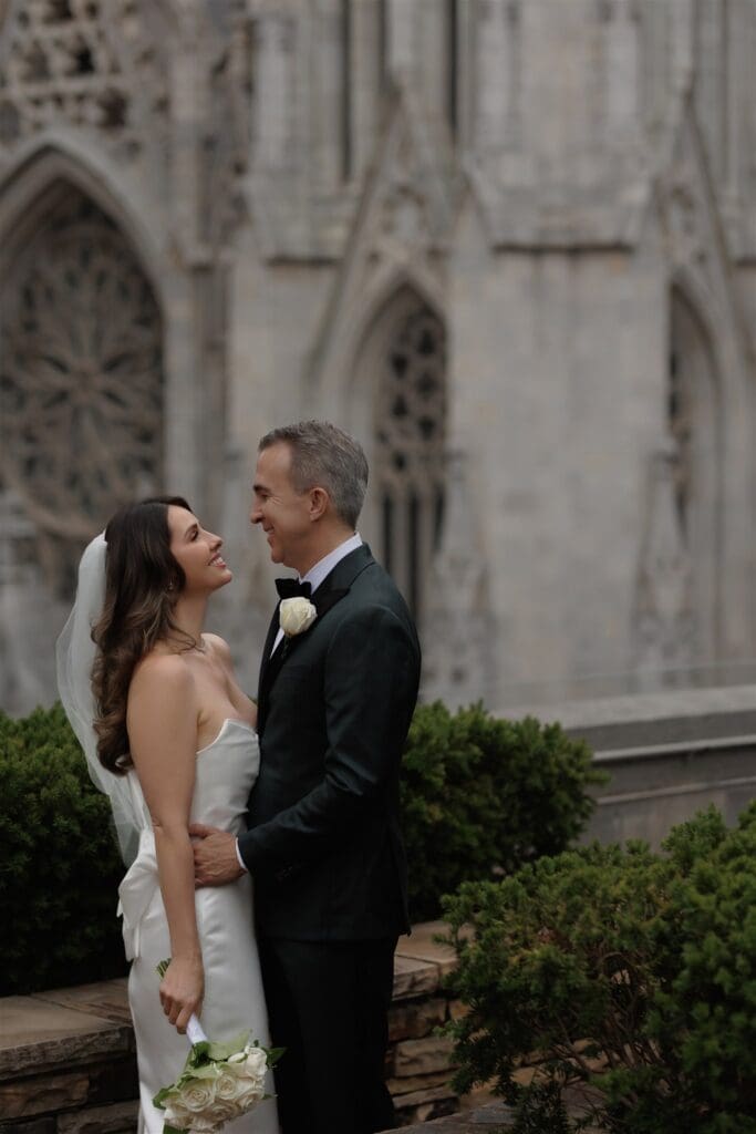 cute picture of the newlyweds smiling at each other