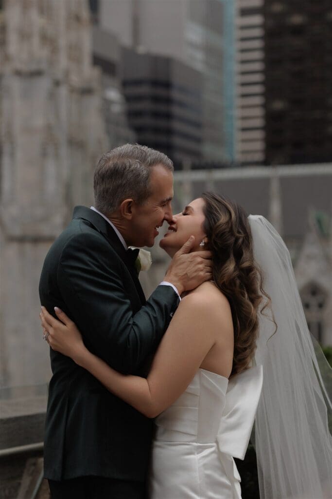 cute picture of the newlyweds kissing 