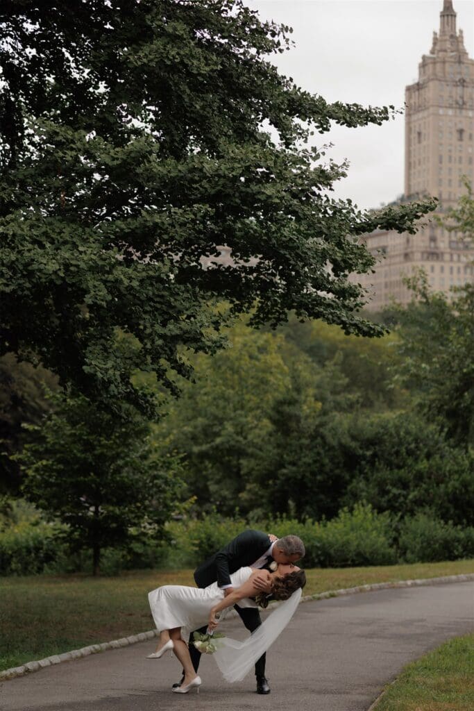 cute picture of the newlyweds kissing 