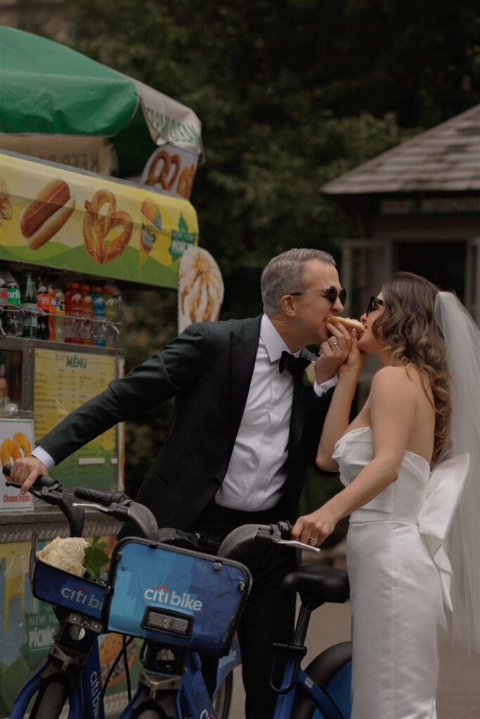 couple celebrating their elopement with hot dogs