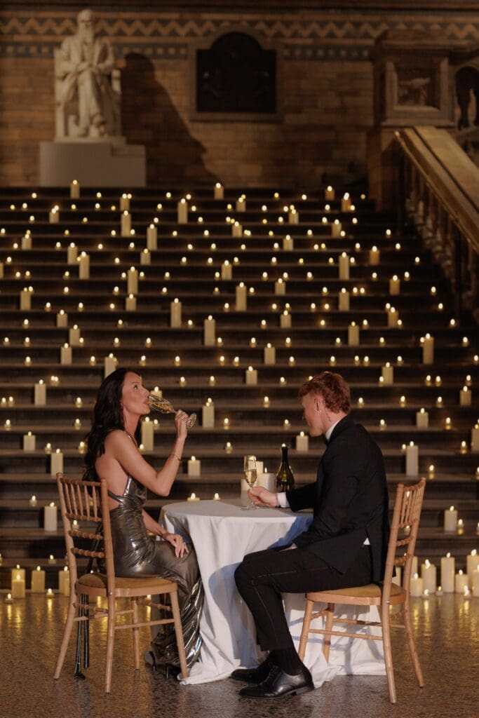 Couple celebrating their engagement with champagne
