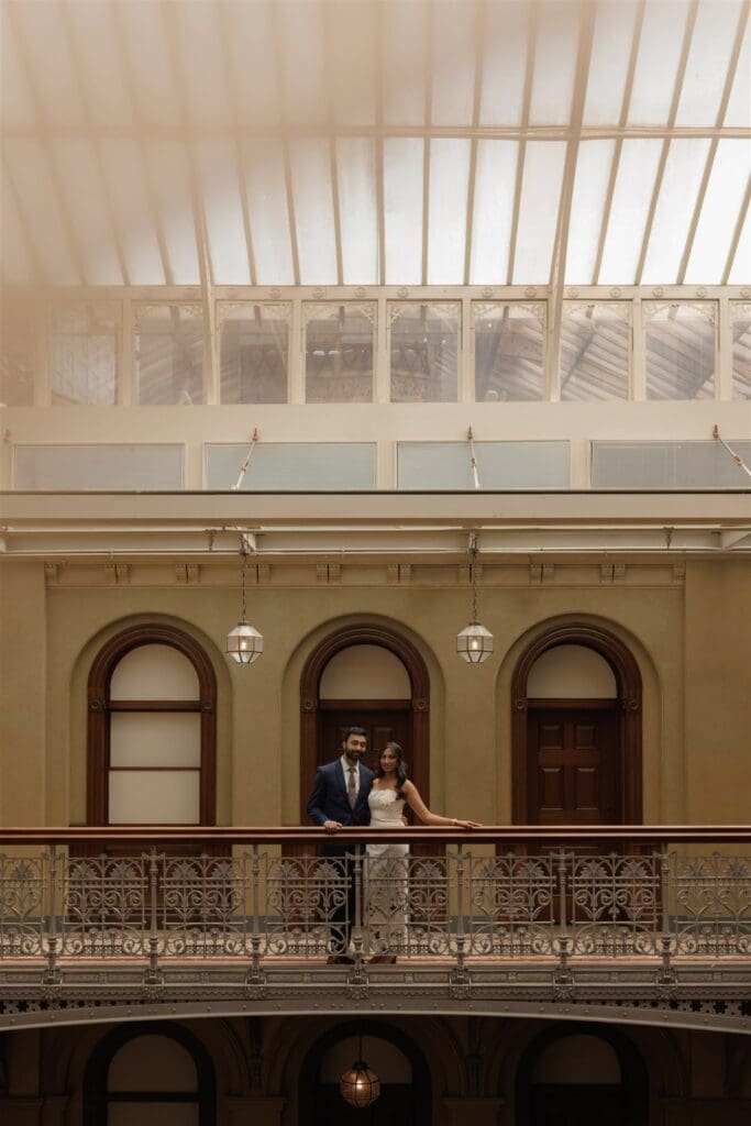 couple smiling at the camera during their photoshoot