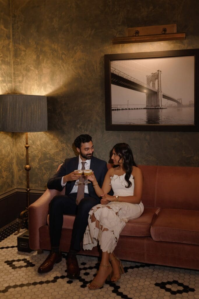 couple celebrating their engagement with champagne 