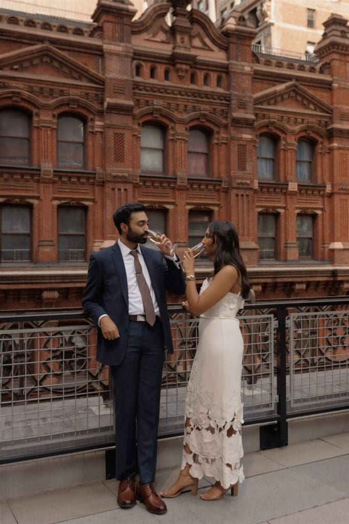 couple celebrating their engagement with champagne 