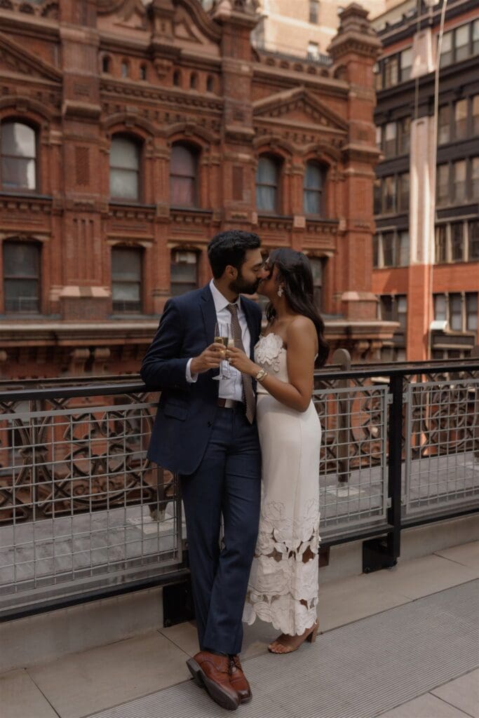 cute picture of the newly engaged couple kissing