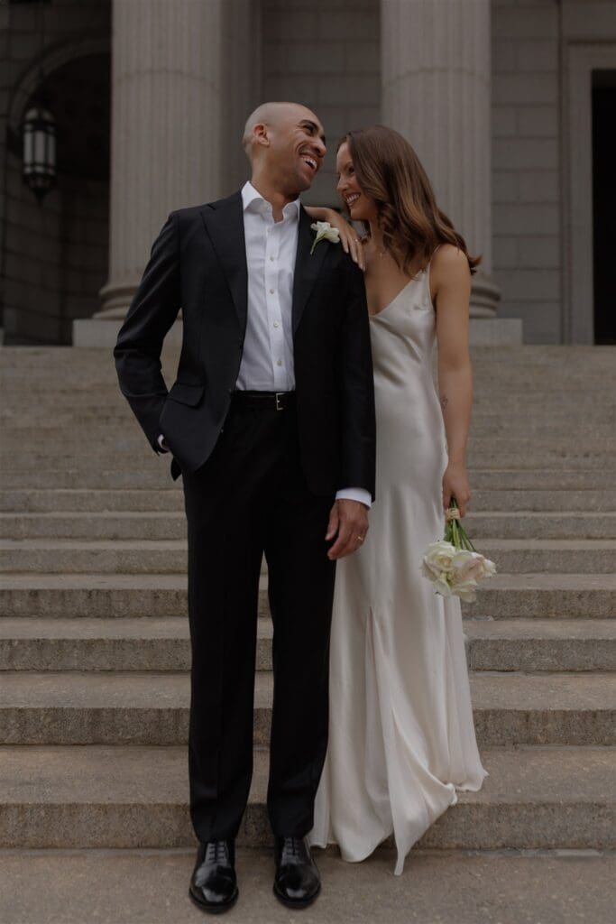 groom kissing the bride on the cheek