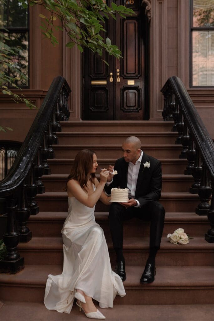 couple trying their elopement cake