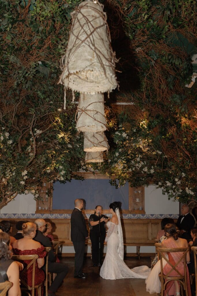 bride and groom holding hands during their ceremony
