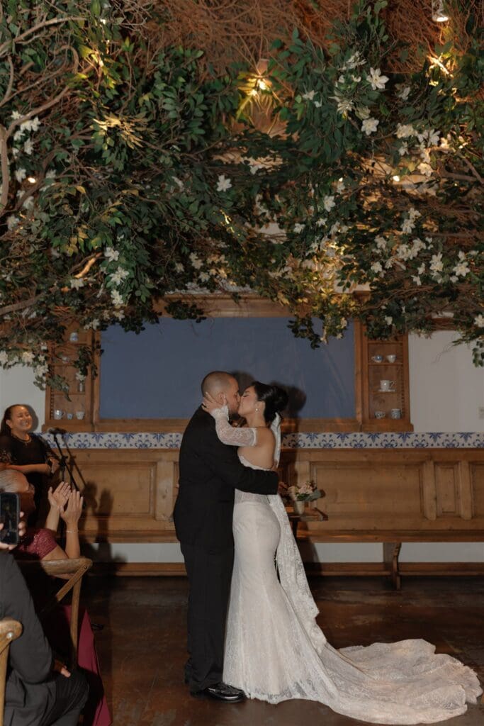 bride and groom kissing after their ceremony