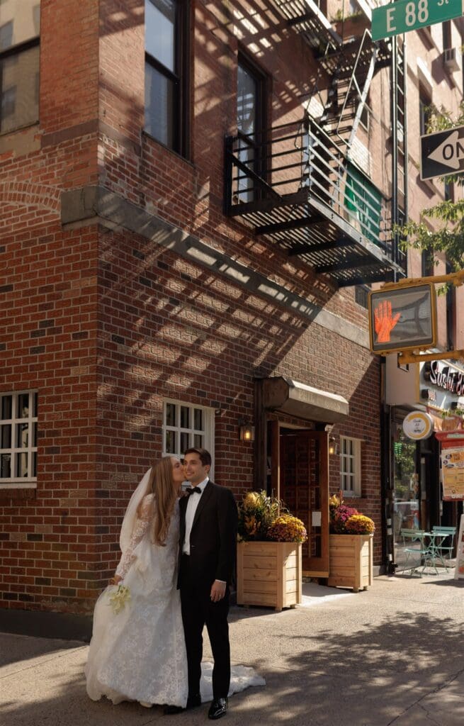 bride kissing the groom on the cheek