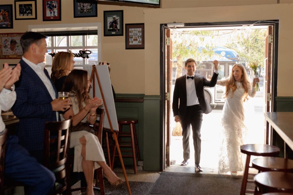 happy couple arriving at their dream reception party