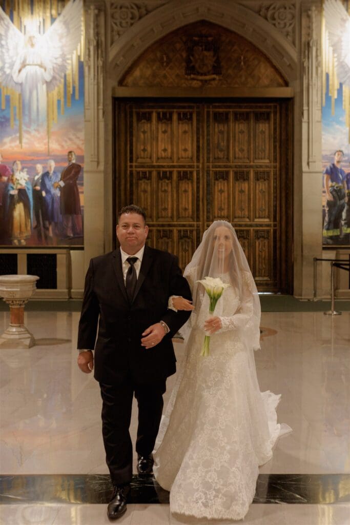 stunning picture of the bride walking down the aisle