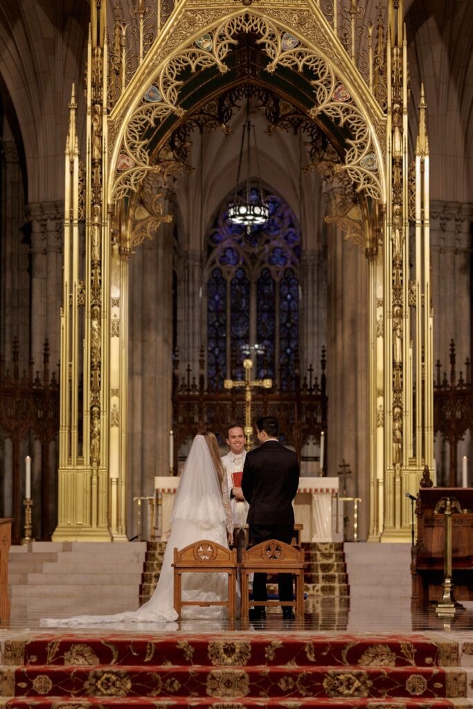 bride and groom holding hands during their ceremony