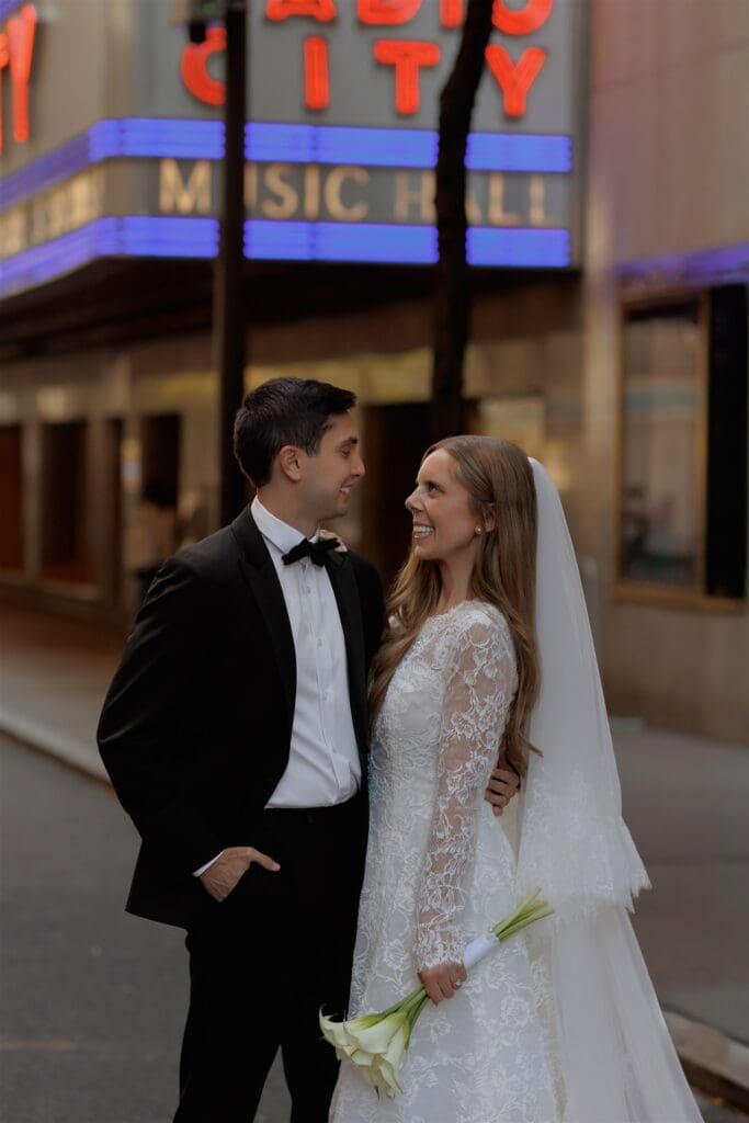 cute picture of the newlyweds smiling at each other