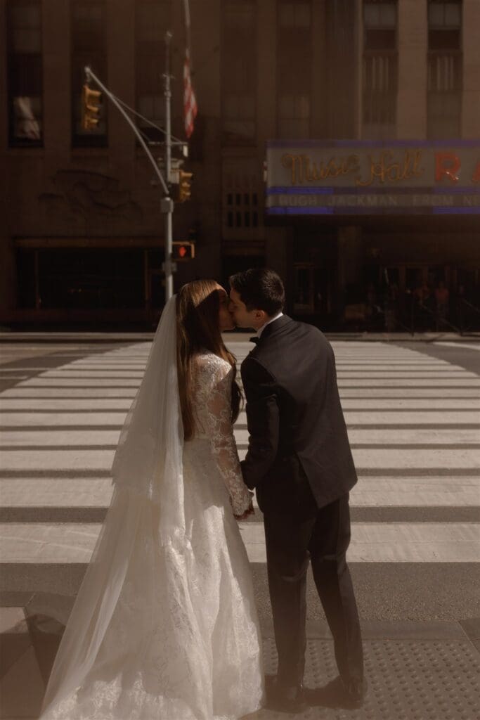 groom kissing the bride on the cheek