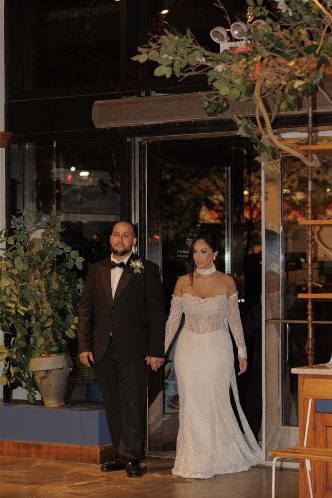 cute couple entering their reception party