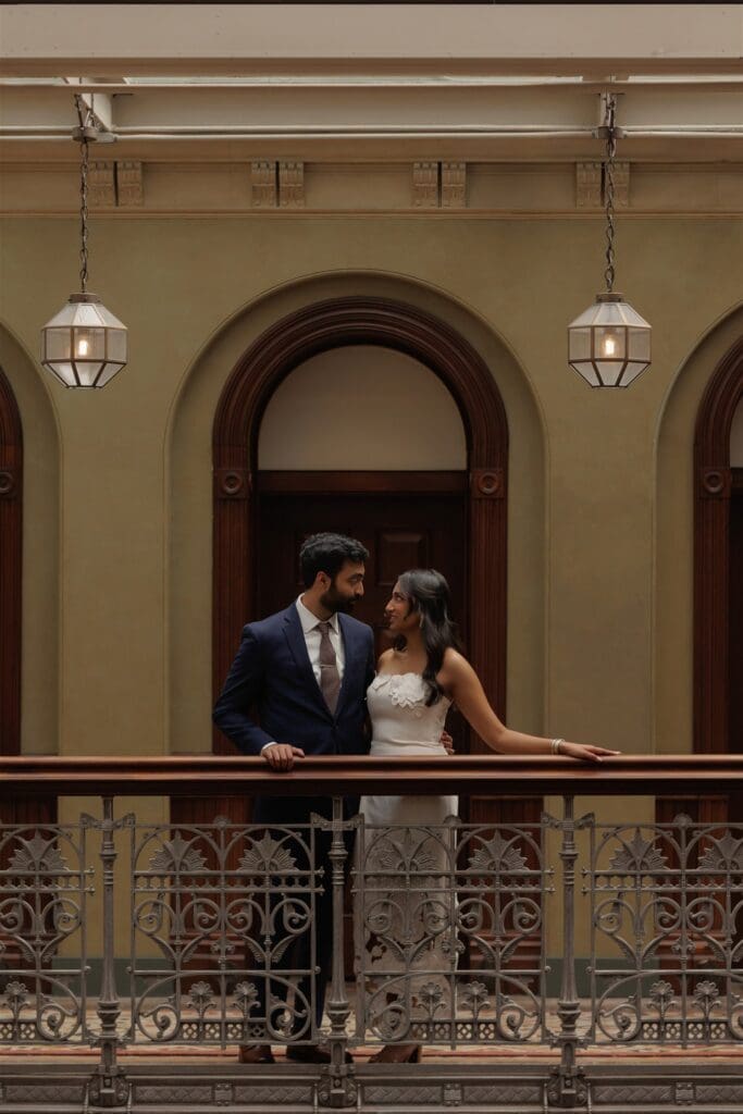 couple smiling at each other during their engagement photos